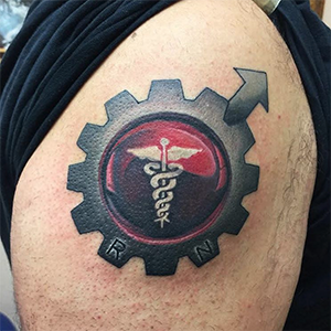 MJ Bonanno - Medical Symbol Gear Tattoo